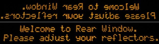‘Welcome to Rear Window. Please adjust your reflectors’ placeholder message in amber LED type
