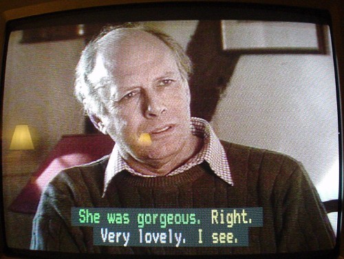 Green, yellow, white, and green sentences in two caption lines