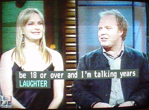 Caption in blue reads LAUGHTER below the end of a previous sentence in white