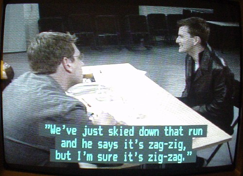 Double quotation marks in a two-line caption are all closing double quotes, ”