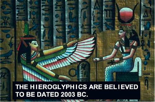 Screenshot shows Egyptian figures overlaid atop hieroglyphics and ‘caption’ text reading THE HIEROGLYPHICS ARE BELIEVED TO BE DATED 2003 BC.