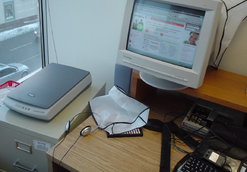 Scanner sits on filing cabinet alongside desk