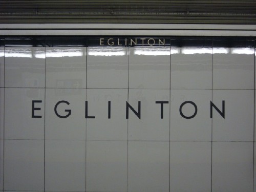 Glossy grey tiles are the background for the word EGLINTON in light font