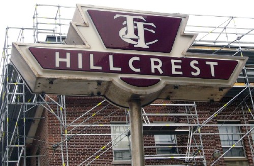 Three-dimensional sign in the shape of the TTC logotype reads HILLCREST