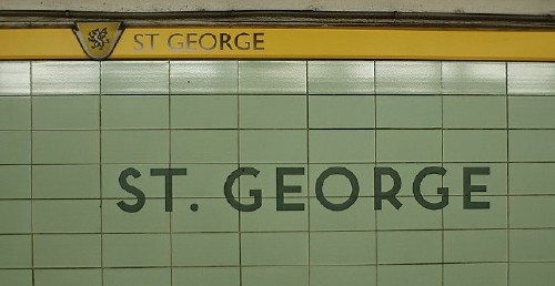 Yellow strapline reads ST GEORGE on tile wall reading ST. GEORGE