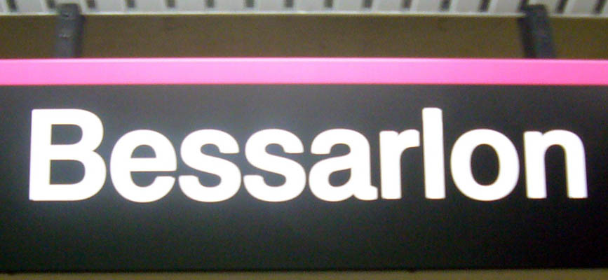 Sign with pink line across the top reads Bessarlon