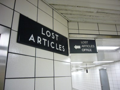 Two signs for LOST ARTICLES and LOST ARTICLES OFFICE use different fonts and sit next to each other