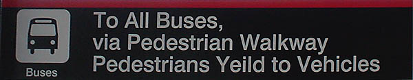 Sign reads Pedestrians Yeild to Vehicles