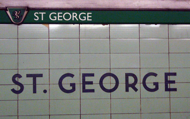 Wall with original ST. GEORGE inscription and green ST GEORGE banner with icon along the top
