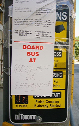 Bus stop has handwritten sign