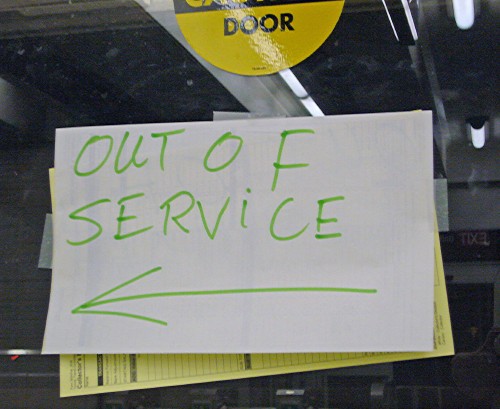 Door is labelled OUT OF SERVICE with handwritten sign