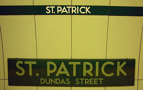 Green wall with ST. PATRICK on dark strapline and large metal plate reading ST. PATRICK DUNDAS STREET