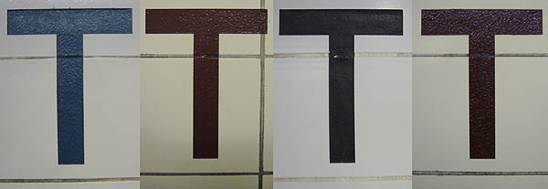 Close-ups of four letter Ts from subway stations