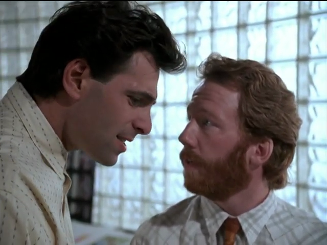 Elliot looking up at a serious Michael