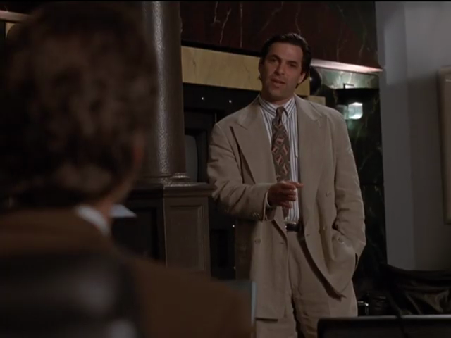 Michael in almost unstructured cream-coloured suit, with tie