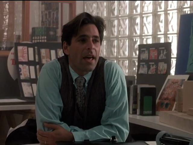 Michael in minty-green shirt in office