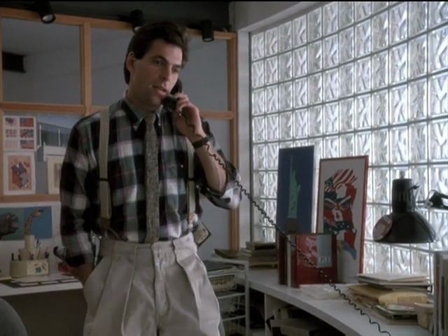 Michael in severely pleated bone-coloured pantalon, suspenders, plaid shirting