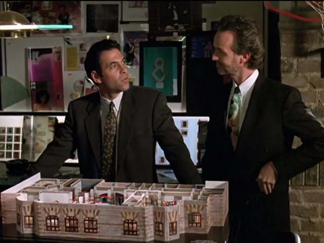 Michael and Miles standing over diorama