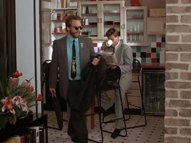 Office kitchen with bright subway-tiled backsplash