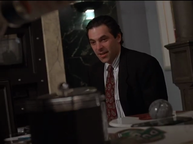 Walls behind Michael show panelling in veined black granite and mottled grey styles