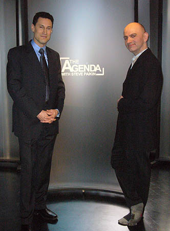 Me in stockinged feet posing with Steve Paikin by ‘The Agenda with Steve Paikin’ logotype