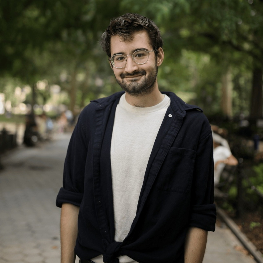 Aleksic in sweater knotted at waist